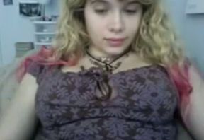 Horny webcam model with curly hair whips out her boobs