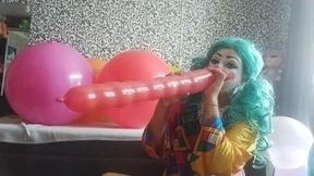 clown girl blow and play with balloons