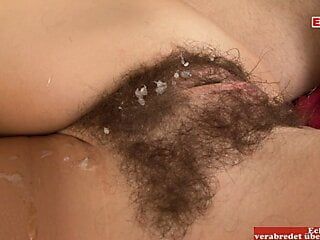 Brunette with small tits gets a cumshot on her hairy pussy